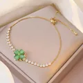 Bracelet chaîne dorée avec trèfle en œil-de-chat vert et zircons carrés brillants - Bracelet Œil de Chat (TS0062)
