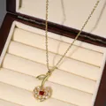 Detailed shot of cherry pendant necklace with red heart stone and white zircons - Red Heart Side Stone Decor (X2710)