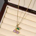 Detailed view of cherry pendant necklace with pink stones on a beige velvet jewelry box - Pink Green Leaf Cherry Style (X2607)