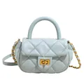 Elegant light blue quilted crossbody bag with a gold twist lock and chain strap - Blue
