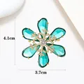 Detail view showing emerald green snowflake brooch dimensions of 4.1cm by 3.7cm - Xx0109