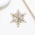 Elegant rotating snowflake brooch with gold base, white pearls and sparkling crystals - Xx0129
