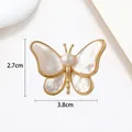 Detailed view of butterfly brooch with pearl inlay and dimensions 3.8cm by 2.7cm - MOP Pearl Gold Butterfly Style (XX0029)