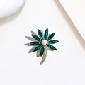 Detail of flower brooch with dark green crystal petals and central white pearl accent - Dark Green Crystal Pearl Flower Style (XX0022)