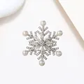 Elegant rotating snowflake brooch with silver plating, sparkling zircons and white pearls - Xx0130