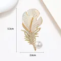 Detail shot of feather brooch with size markers 5.3cm x 2.6cm and pearl accent - Iridescent Shell Pearl Feather Style (XX0026)