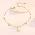 Close-up of golden butterfly anklet with shell charms and sparkling zircon accents - Matte Shell Butterfly Style (TL0009)
