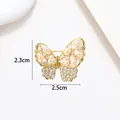 Detailed close-up of golden butterfly brooch with white pearls and crystals, size 2.3x2.5cm - Gold Pearl Pave Zirconia Butterfly Style (XX0057)