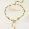 Detail of gold layered anklet with zircon flower pendant and elegant tassel fringe - Double Layer Flower Tassel Style (TL0012)