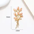 Detail of elegant pearl bouquet brooch with gold finish and dimensions 5.6cm by 2.3cm - Gold Pink Pearl Small Bouquet Style (XX0051)