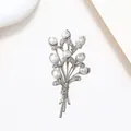 Detailed macro view of an elegant floral bouquet brooch with pearls and shimmering crystals - Silver Polished Pearl Rhinestone Bouquet Style (XX0052)