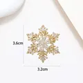 Macro view of gold snowflake brooch with crystal details and 3.6cm by 3.2cm dimensions - Xx0159