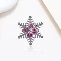 Close-up of snowflake brooch with pink heart-shaped crystals and sparkling zircon details - Xx0188