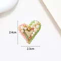 Macro view of heart-shaped pearl brooch with dimension details 2.4cm by 2.3cm - Pink Green Faceted Bead Heart Style (XX0072)