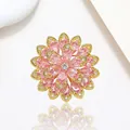 Macro view of crystal flower brooch with pink teardrop petals and gold metal base - Xx0200