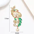Detailed view of phoenix pearl brooch with crystal zircon inlay and gold finish - Luxury Phoenix Peacock Pearl Style (XX0084)