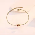 Detail of the lobster clasp and fine gold 999 engraving on a minimalist gold heart anklet - Gold Bar 999 Pendant Style (TL0032)