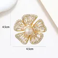 Close-up of a 4.5cm gold floral pearl brooch with detailed zircon-inlaid petals - Pave Baguette Zirconia Large Pearl Flower Style (XX0137)