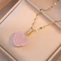 Close-up of pink crystal heart pendant with gold zircon-set clasp in velvet box - Pink (X0426)