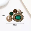 Vintage gold brooch featuring a large green stone and champagne pearl, 3.8cm wide - Vintage Green Gem Champagne Pearl Style (XX0104)