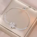 Silver flower charm bracelet with micro-paved zircons and adjustable sliding box chain - Rotating Bracelet (TS0169) / Steel