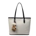 Minimalist cream woven tote bag with black leather handles and cute bear charm - White and Black