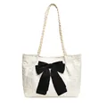 Fashionable white textured tote bag featuring a large black bow and woven shoulder straps - White