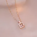 Collier flacon de parfum or rose avec halo de zircons et diamant dansant - Style Flacon Dansant Or Rose