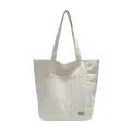 Cremefarbene vertikal gesteppte Shopper Tasche mit Handmade-Label und Vordertasche - Beige