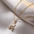 Titanium steel bear pendant necklace with sparkling cubic zirconia on beige silk background - Shell Material Bear Style (X0385)