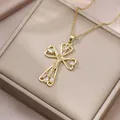 Exquisite gold cross necklace with zircon inlays on a champagne jewelry box - Cutout Heart Cross Necklace (X2754) / Gold