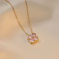 Golden magnetic clover necklace with pink heart crystals on champagne satin background - Pink Heart Necklace
