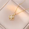 Rotating four-leaf flower necklace in gold finish with sparkling cubic zirconia inlay - Gold Hollow Snowflake Style (X0479)