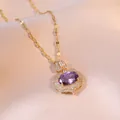 Elegant gold pendant necklace featuring oval purple gemstone and white zircon on silk fabric - Purple Zirconia (X0499--2)
