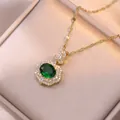 Golden necklace with emerald green gemstone pendant and micro-pave diamonds in jewelry box - Emerald Green (X0499--1)