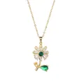 Detail of spinning sunflower necklace with emerald center and baguette zircon petals - Rotatable Necklace / Gold - Sunflower Style 3