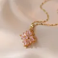 Elegant gold titanium steel necklace featuring a rotating pink zircon floral pendant - Pink Rotating Necklace