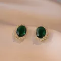 Vintage gouden oorknopjes met ovale groene edelsteen en halo van zirkoon - Smaragd Oorbellen