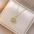 Close-up of a rotating flower necklace with green stones and gold plated details - Gold Olive Green Floral Style (X0714) / Gold