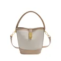 Retro color-block bucket bag in beige suede and tan leather with gold metal lock buckle - Khaki