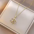 Rotating gold flower necklace with purple water-drop gems and white zircon inlay - Gold Purple Floral Style (X1305)