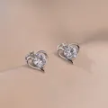 S925 silver heart stud earrings with dancing zircon stones on champagne satin fabric - Heart Stud Earrings Set Style (E385)