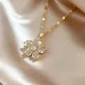Elegant gold flower pendant necklace with clear zircons on champagne silk background - White Daisy Clavicle Necklace