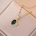 Elegant gold emerald zircon pendant necklace set in champagne velvet jewelry box display - Emerald Green Zirconia Necklace (X1643)
