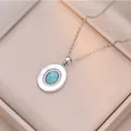Elegant silver turquoise oval pendant necklace with zircon halo on champagne velvet - Oval Turquoise Pendant (X1545) / Silver