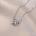 Guardian wings necklace with heart zircon pendant on white satin background - Guardian Wings Heart Necklace (X1785) / Steel