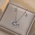 Collier cœur en argent avec gemmes roses et pendentif nœud sur boîte à bijoux - Collier Coeur Noeud (X2117)