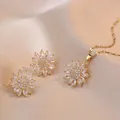 Elegant gold sunflower jewelry set with sparkling zircon crystals on champagne silk - Gold Necklace Earring Set