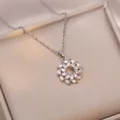 Elegant silver flower wreath pendant necklace with marquise-cut zircons on a champagne box - Flower Necklace / Steel