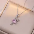 Elegant silver rabbit moon necklace with pink stone and white crystals in a jewelry box - Moon Bunny Necklace (X2466)